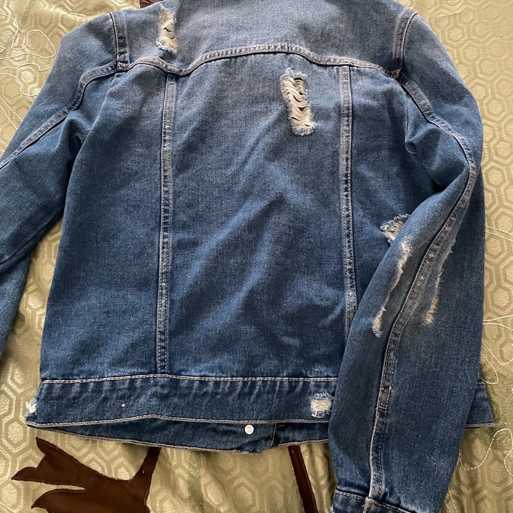 Distressed jean jacket